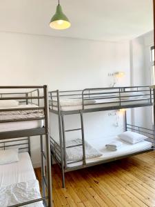 Posteľ alebo postele v izbe v ubytovaní Leon Hostel