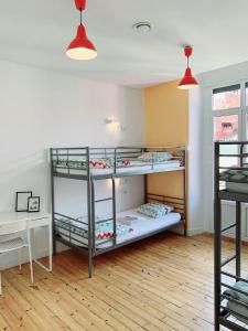 Posteľ alebo postele v izbe v ubytovaní Leon Hostel