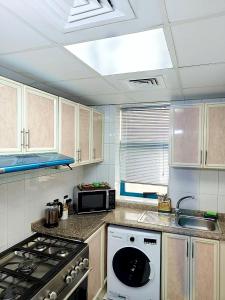 Kuchyň nebo kuchyňský kout v ubytování Ajman Family AIDEN Premium VIP