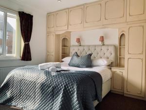 a bedroom with a king sized bed with a canopy at Home like 3 bed house Sheffield in Sheffield