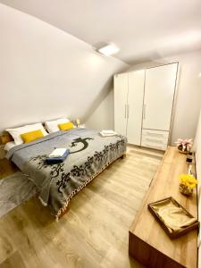 a bedroom with a bed and a wooden floor at Mountain view in Bohinj in Bohinj