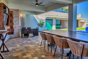 a large dining room with a large table and chairs at Shangri-LA luxury Mansion, Heated Pool in Puerto Peñasco