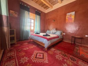 Postel nebo postele na pokoji v ubytování KASBAH ALTAÏR