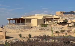a house in the middle of a desert at Les Jardins de la Santé in Tamazouzte
