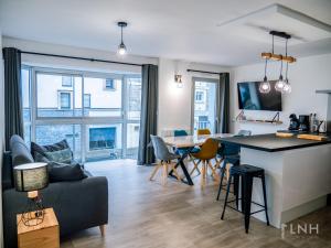 a living room with a couch and a table at L'appartement de jeanne in Quimper