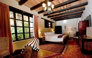 Postel nebo postele na pokoji v ubytování Guayaba Inn Boutique Hotel