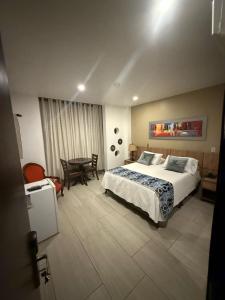 Voodi või voodid majutusasutuse Hotel Ucla Center toas