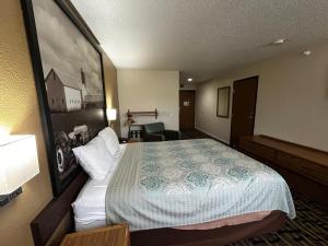 Letto o letti in una camera di OYO West Point Inn