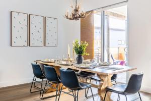 a dining room with a wooden table and chairs at Adora in the Pines with Axe Throwing in Flagstaff