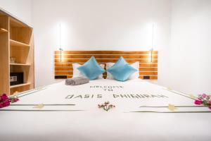 Postel nebo postele na pokoji v ubytování Oasis Dhigurah