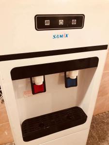 a white oven with red and blue socks on it at July house in Wadi Musa +22 photos