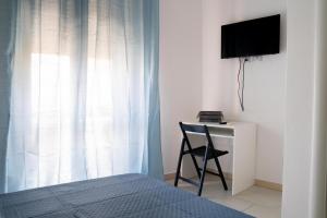 TV a/nebo společenská místnost v ubytování Eulalia Bnb Alghero