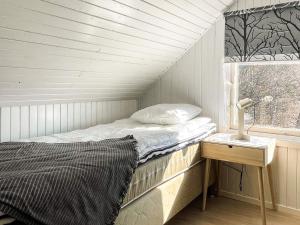 Una cama o camas en una habitación de 5 person holiday home in SÖLVESBORG