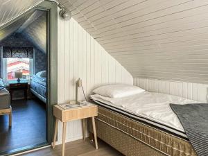 Una cama o camas en una habitación de 5 person holiday home in SÖLVESBORG