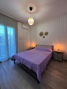 Ένα ή περισσότερα κρεβάτια σε δωμάτιο στο Melina's house