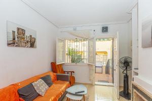 a living room with a couch and a table at CASA Maria do ceu orihuella costa alicante in Orihuela Costa