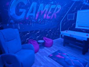 a room with a game room with a game table at Little Paradise Spa Appartement in Gummersbach