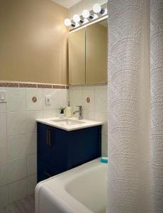 a bathroom with a sink and a mirror at Girls Night Out in Toronto +5 photos