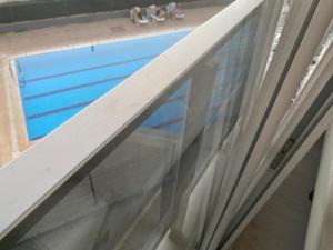 a window in a room with a view of a pool at Smart Apartment in Antalya +13 photos