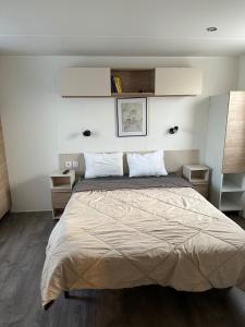 Ένα ή περισσότερα κρεβάτια σε δωμάτιο στο Mobile home Harley