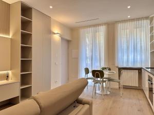 a living room with a couch and a table at Appartamento - Diamante - in Milan