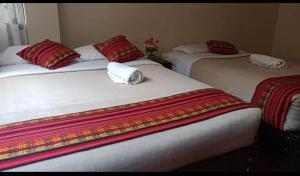 Postel nebo postele na pokoji v ubytování Hostal DESCANSO