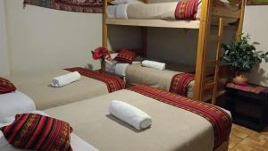 Postel nebo postele na pokoji v ubytování Hostal DESCANSO