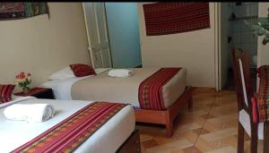 Postel nebo postele na pokoji v ubytování Hostal DESCANSO