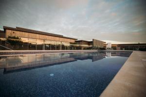 a large swimming pool in front of a building at 64 Una in Carbis Bay