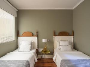 Ein Bett oder Betten in einem Zimmer der Unterkunft Feel Canteras