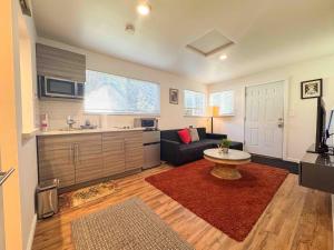 a living room with a couch and a table at Modern Private Guesthouse in Seattle in Seattle