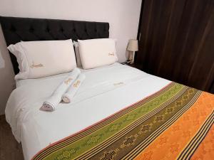 Postel nebo postele na pokoji v ubytování Samalá Casa Hotel