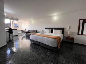 Postel nebo postele na pokoji v ubytování Samalá Casa Hotel