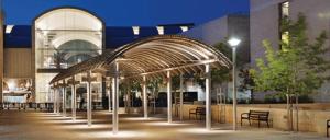 a building with an archway with benches in front of it at Ar'ar Prestige Cozy Top place in Modi'in