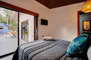 Postel nebo postele na pokoji v ubytování Villas y Casa Dìwö - Puerto Viejo + 37 fotografií