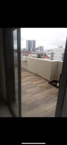 a view of a balcony with a view of a city at פנטהאוז 2 חדרים עם נוף משגע ברחובות in Rechovot