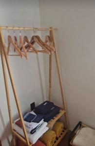 a room with a shelf with clothes and hangers at CASA COLONIAL Ilha da Croa in Barra de Santo Antônio +15 photos