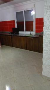 a kitchen with a counter with a laptop on it at Saidia palace in Saïdia