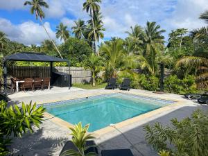 Bazén v ubytování Palm Tree Villas nebo v jeho okolí