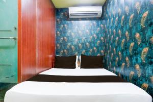 Postel nebo postele na pokoji v ubytování Hotel O A K Residency + 38 fotografií