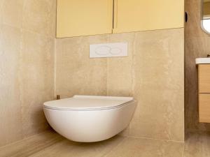 a bathroom with a white toilet in the corner at Charming studio 2P- Montorgueil in Paris +1 photo
