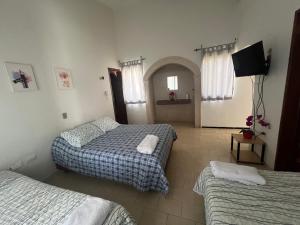 Ένα ή περισσότερα κρεβάτια σε δωμάτιο στο Villa Odalys Cozy Mexican style house +14 φωτογραφίες