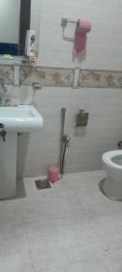 a bathroom with a sink and a toilet at Renting Rooms in Dargai