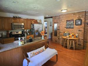 a kitchen with a counter and a table in a room at Hidden Gem on Hidden Valley Lane in Harrell Corner