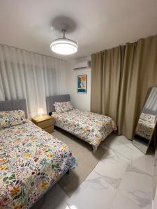 Ένα ή περισσότερα κρεβάτια σε δωμάτιο στο Villa La Casita With Prívate Pool, Cerca De Downtown Punta Cana