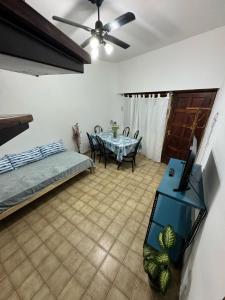 a living room with a table and a tv at CasaSansaba in Gerli