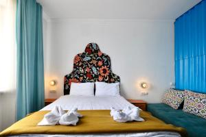 Postel nebo postele na pokoji v ubytování Duet Hostel & Hotel