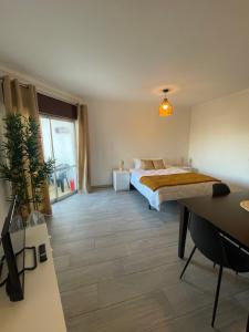 Postel nebo postele na pokoji v ubytování Studio in Praia da Rocha + 7 fotografií