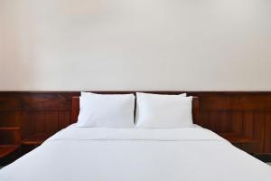 Postel nebo postele na pokoji v ubytování Con Dao Tan Son Nhat Hotel