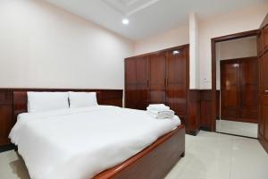 Postel nebo postele na pokoji v ubytování Con Dao Tan Son Nhat Hotel